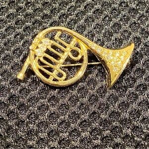 French horn gold tone rhinestone encrusted brooch